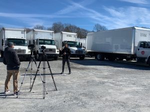 Derek Whaley of Roush CleanTech describes his company's role in repowering some of McAbee's vehicles with the propane system.